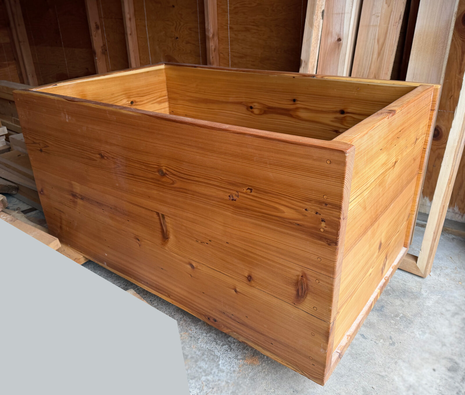 The continuous-log cedar tub in the shop