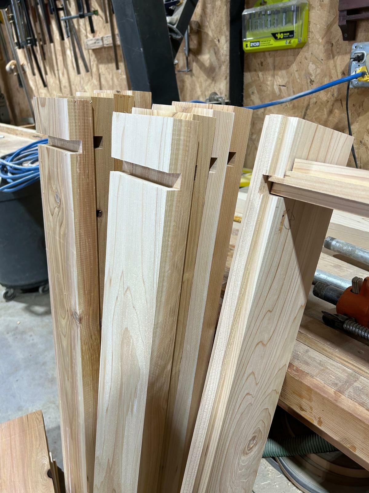 Cedar wall boards with cut joinery before assembly