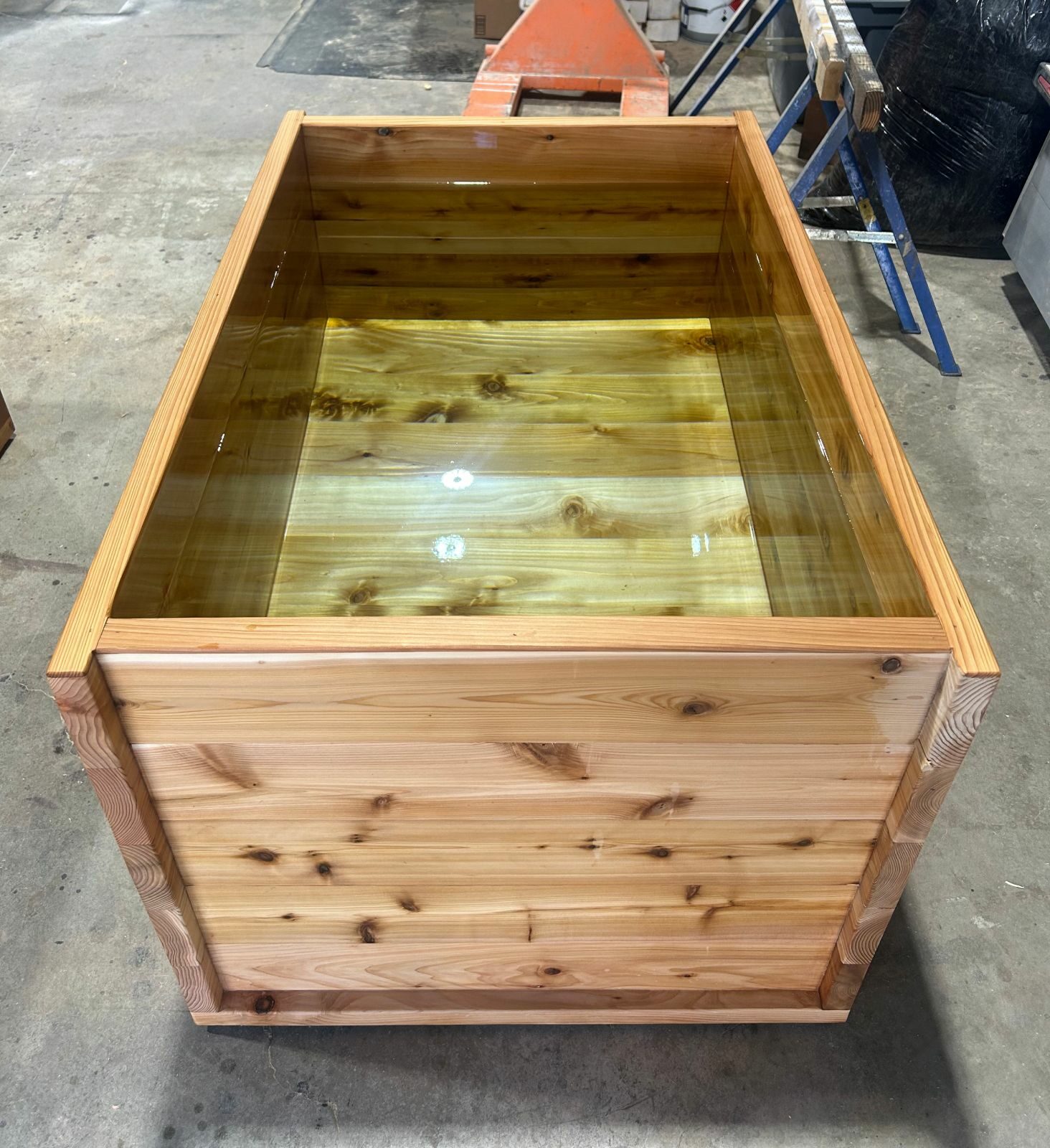 Cedar hot tub filled with water during a leak test